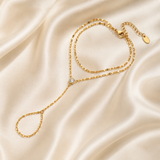 Afterglow – Pulsera hand chain de doble capa con circonita en oro