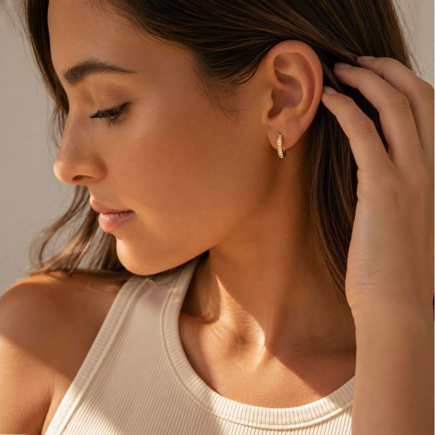 Infinite – Gold pavé cubic zirconia huggie hoops